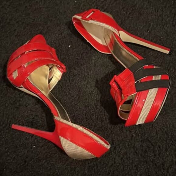 This is a pair of red women's high-heel sandals from the bebe brand. - Picture 3 of 4